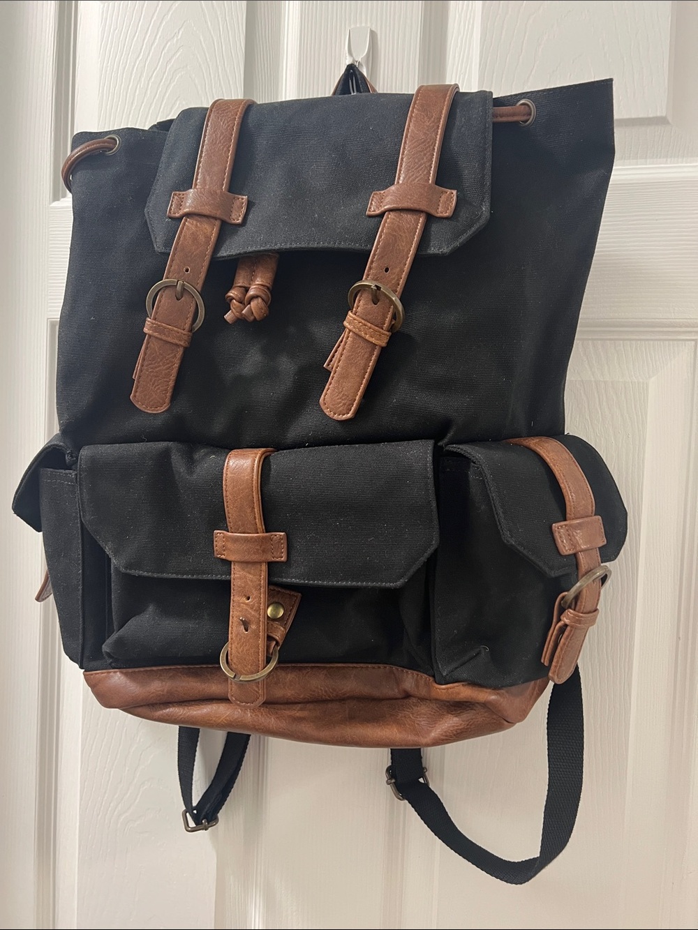 Vintage-Style Black Canvas Backpack with Brown Trim